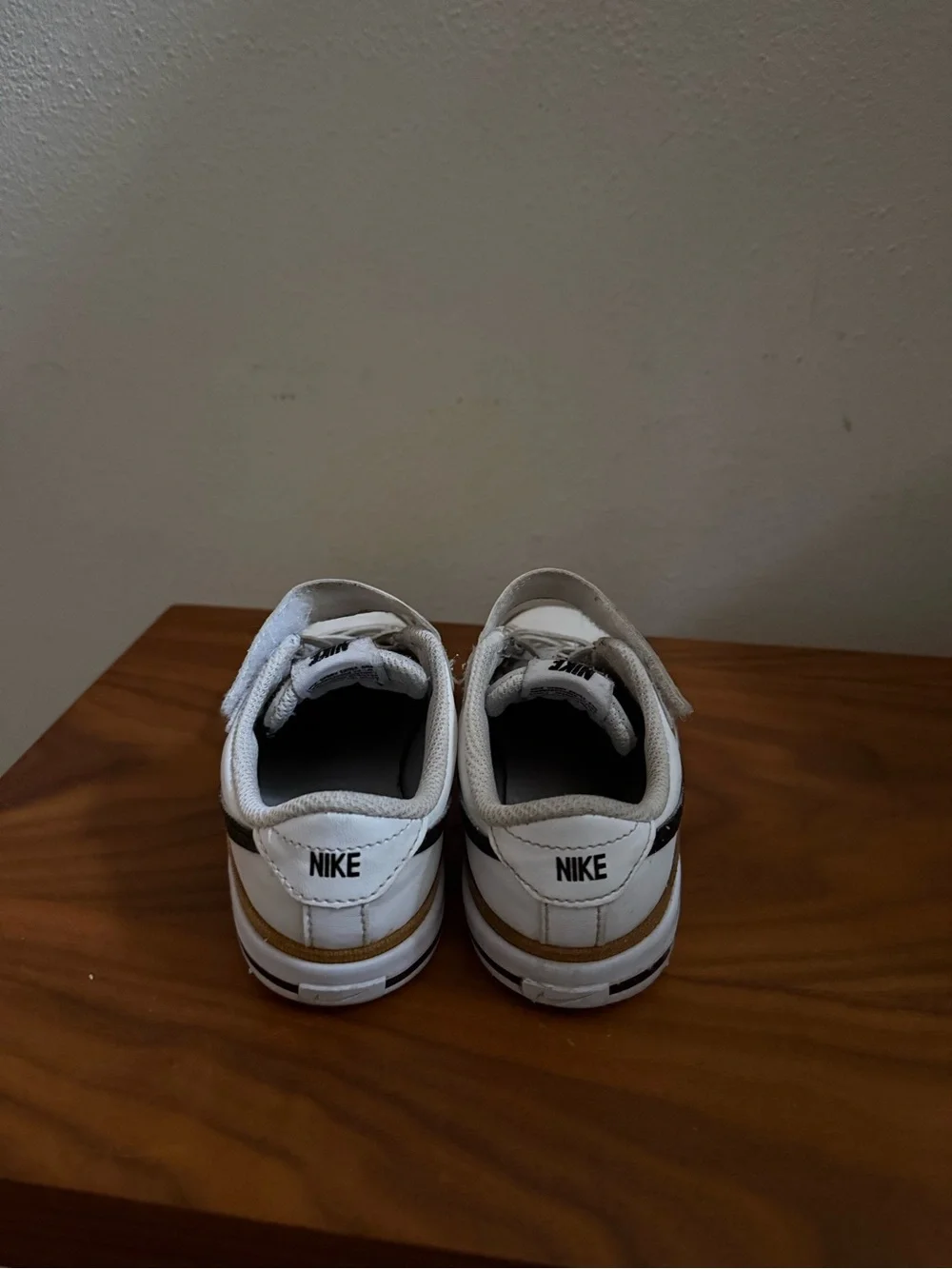Nike Kids White Sneakers with Black Swoosh and Tan Trim